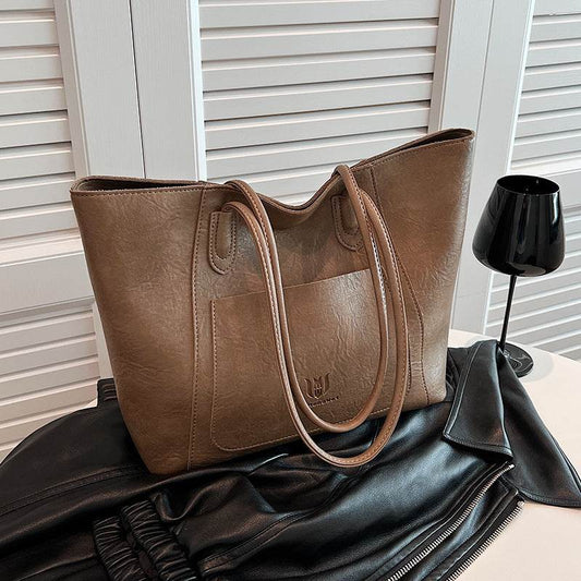 Brown leather retro shoulder bag for women with double straps from Holy Mango Store