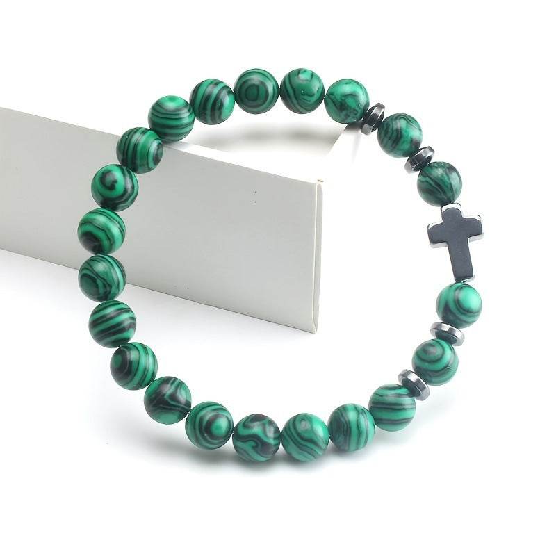 Christian malachite bracelet with green patterned beads and black cross charm from Holy Mango Store