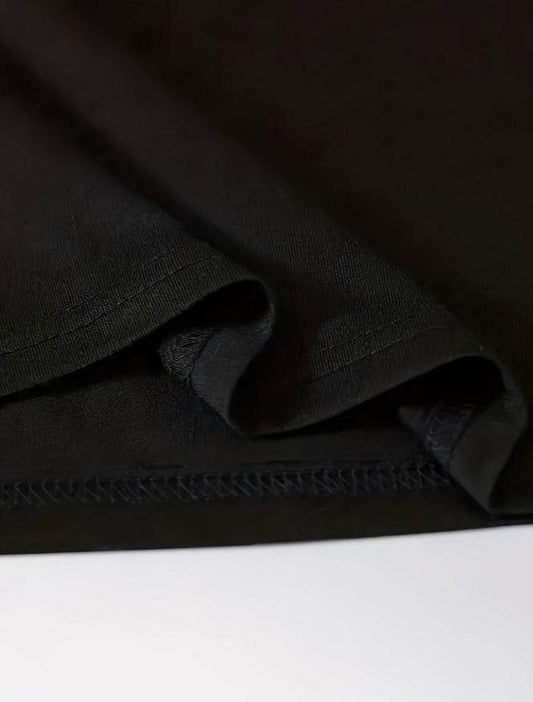 Close-up of black fabric showing detailed stitching on faith inspired t-shirt women from Holy Mango Store