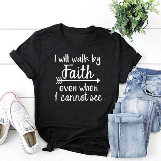 Black inspirational bible verse apparel t-shirt with faith quote paired with blue jeans and white sneakers
