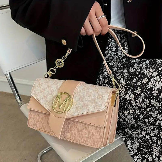 Holy Mango Store beige patterned small crossbody purse for everyday use with gold emblem and adjustable strap