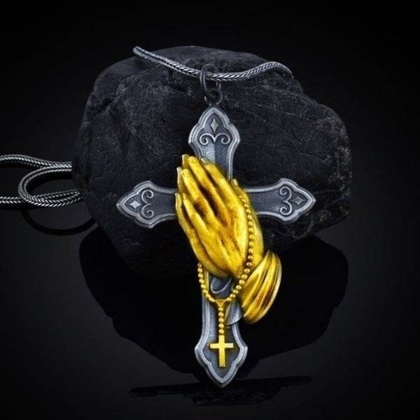 Rugged Christian pendant men with golden praying hands and a silver cross on black stone background