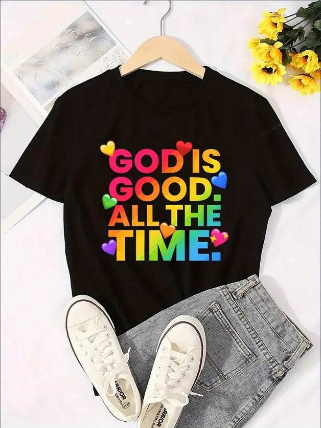 Black Christian graphic tee with colorful God is Good All The Time text and heart accents on a hanger