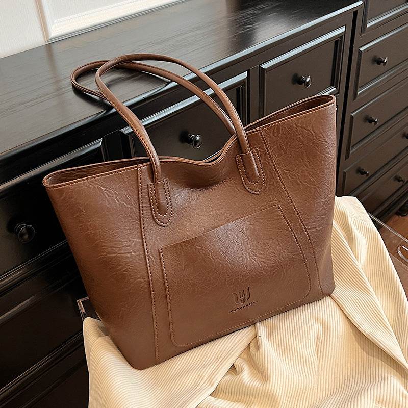 Brown leather retro shoulder bag for women with double handles from Holy Mango Store