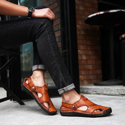 Breathable leather sandals men in brown from Holy Mango Store worn with black rolled-up jeans