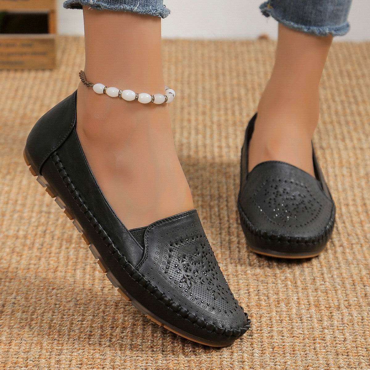 Black casual slip-on shoes for women with perforated design and comfortable sole from Holy Mango Store