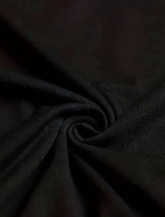 Close-up of black fabric texture for Christian graphic tee for women by Holy Mango Store