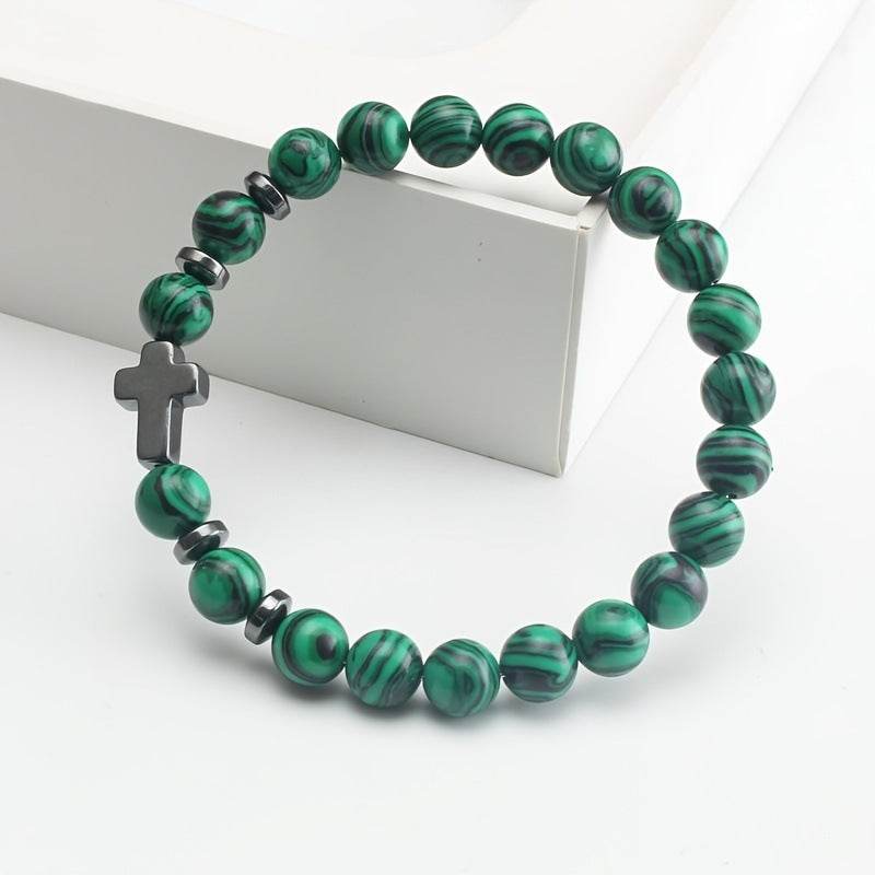 Christian malachite bracelet with green striped beads and black cross charm from Holy Mango Store