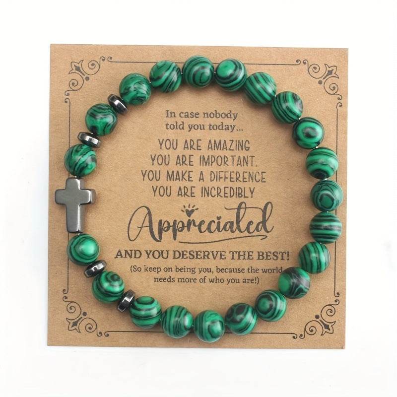 Christian malachite bracelet with green beads and cross on appreciation message card from Holy Mango Store