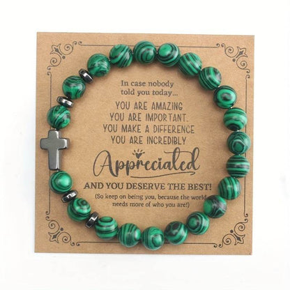 Christian malachite bracelet with green beads and cross on appreciation message card from Holy Mango Store