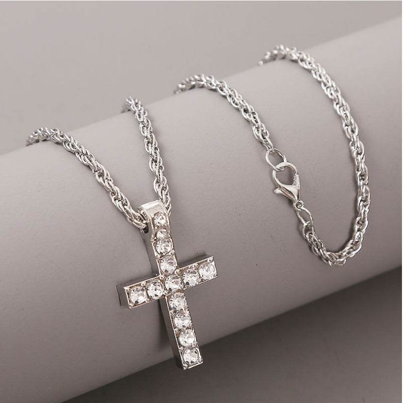 Silver cross pendant necklace with clear gemstones on a silver chain from Holy Mango Store