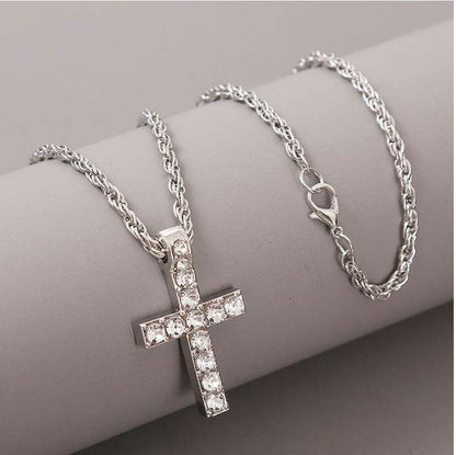 Silver cross pendant necklace with clear gemstones on a silver chain from Holy Mango Store