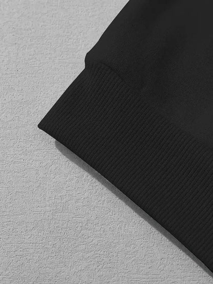 Close-up of black faith hoodie for women sleeve cuff from Holy Mango Store Blessed Goods