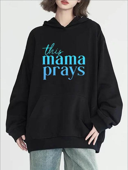 Black faith hoodie for women with blue text this mama prays from Holy Mango Store