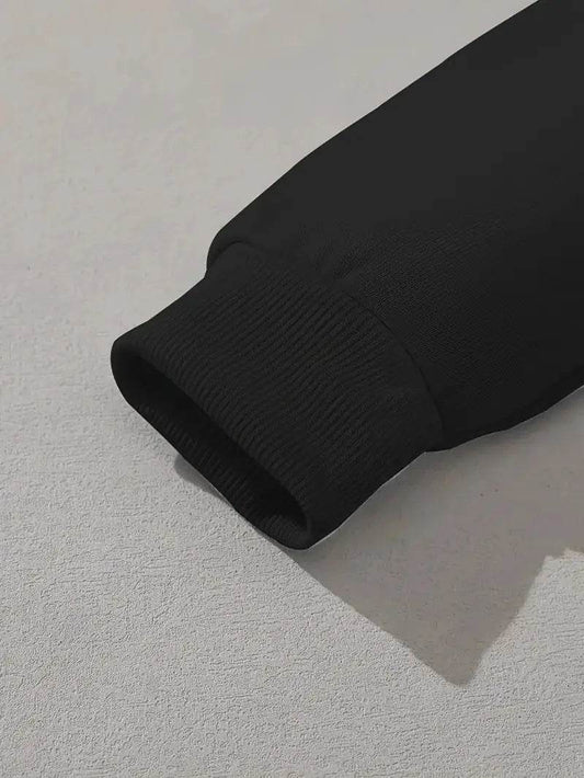 Close-up of black sleeve cuff on faith hoodie for women from Holy Mango Store
