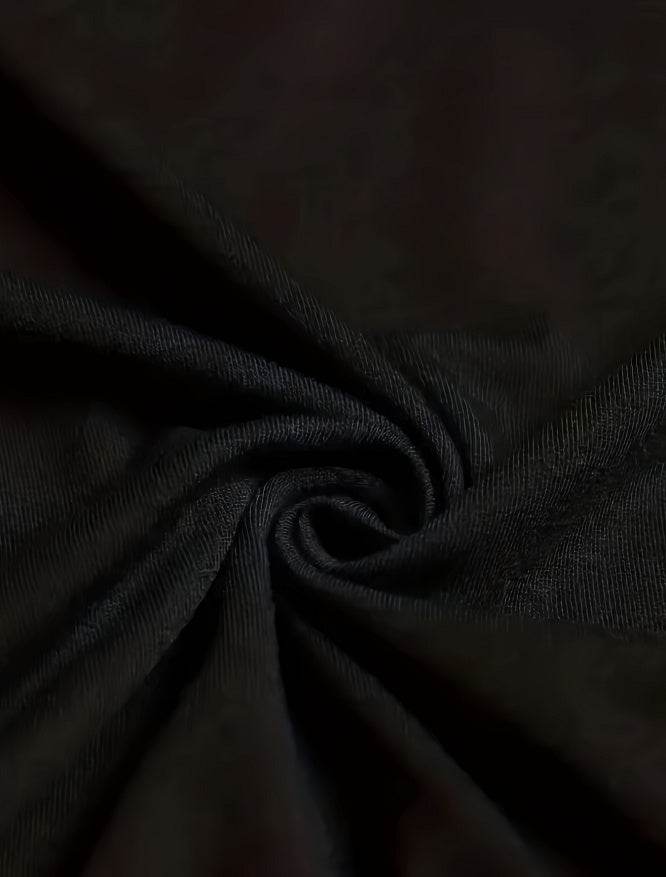 Close-up of black fabric texture spiral for faith inspired casual tee from Holy Mango Store