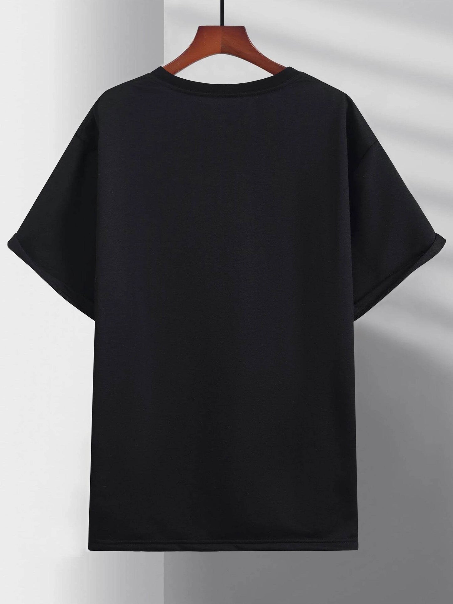 Black plain faith sports t shirt for men hanging on wooden hanger by Holy Mango Store