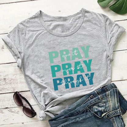 Holy Mango Store gray faith themed t shirt with pray design paired with denim jeans and sunglasses