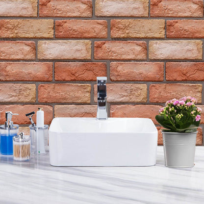 Holy Mango Store 3D brick wall decals for home behind white vessel sink with chrome faucet and potted flowers
