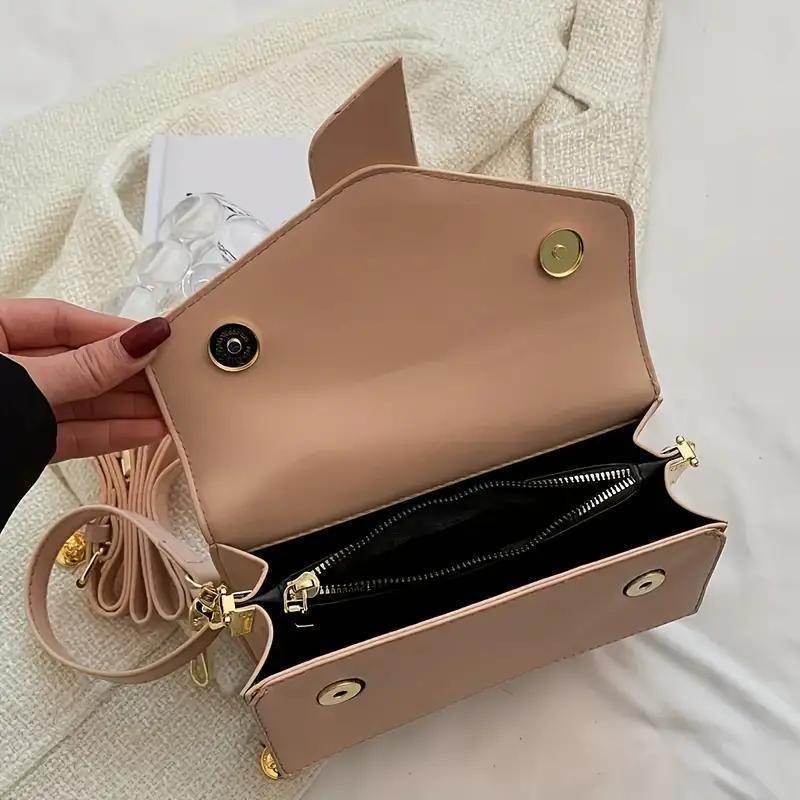 Holy Mango Store nude small crossbody purse for everyday use open showing interior zip pocket and gold hardware