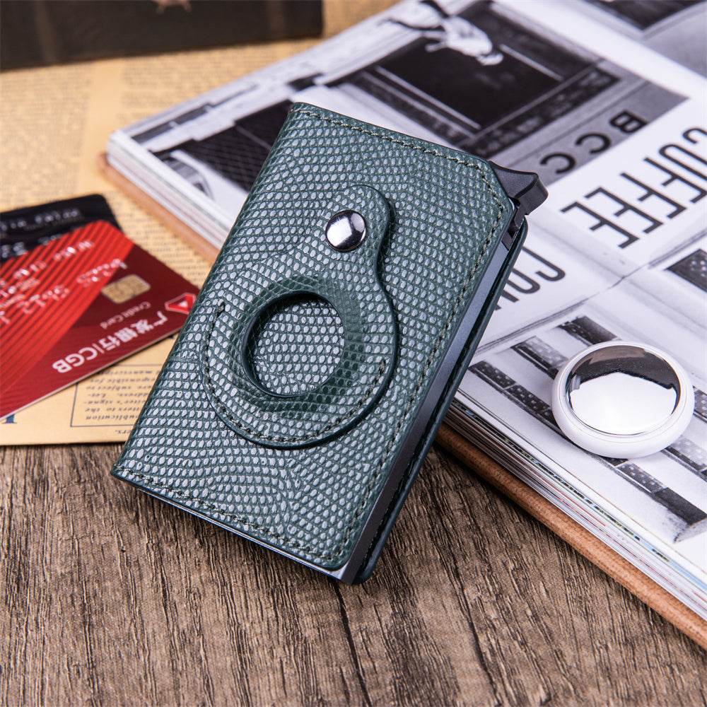 Holy Mango Store men's anti-theft card holder in textured green leather with ring grip on wooden surface
