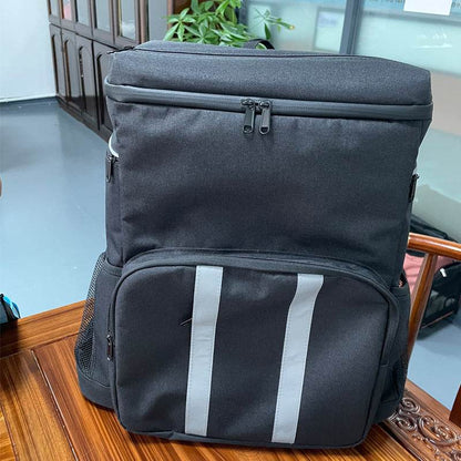 Holy Mango large insulated backpack cooler in black with top zip front pocket reflective vertical stripes and side mesh pockets