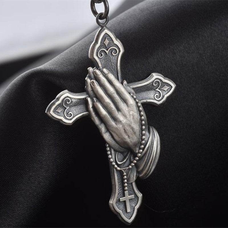 Rugged christian pendant men featuring a detailed cross with praying hands and rosary beads