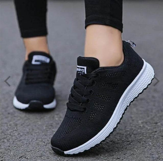 Holy Mango Store women's lightweight sports sneakers in black with white soles and breathable knit design