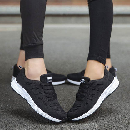 Holy Mango Store women's lightweight sports sneakers in black with breathable knit upper and white sole