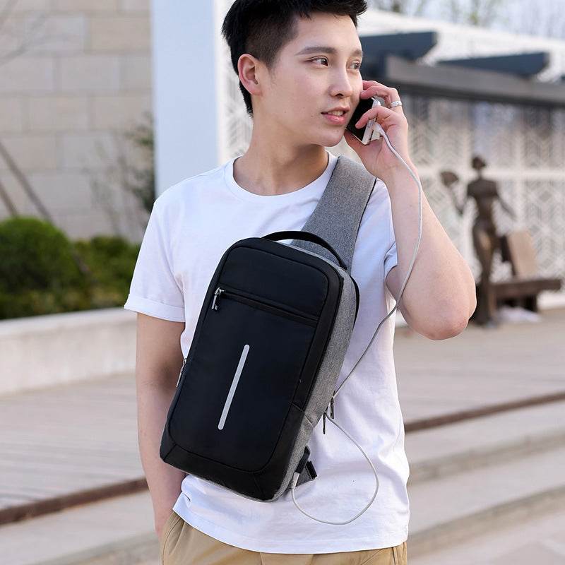 Holy Mango Store anti-theft chest bag with USB charging worn by man in white tee black compact sling