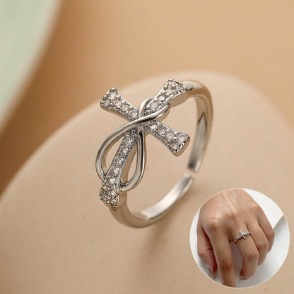 Elegant copper cross ring with embedded crystals and a sleek design from Holy Mango Store