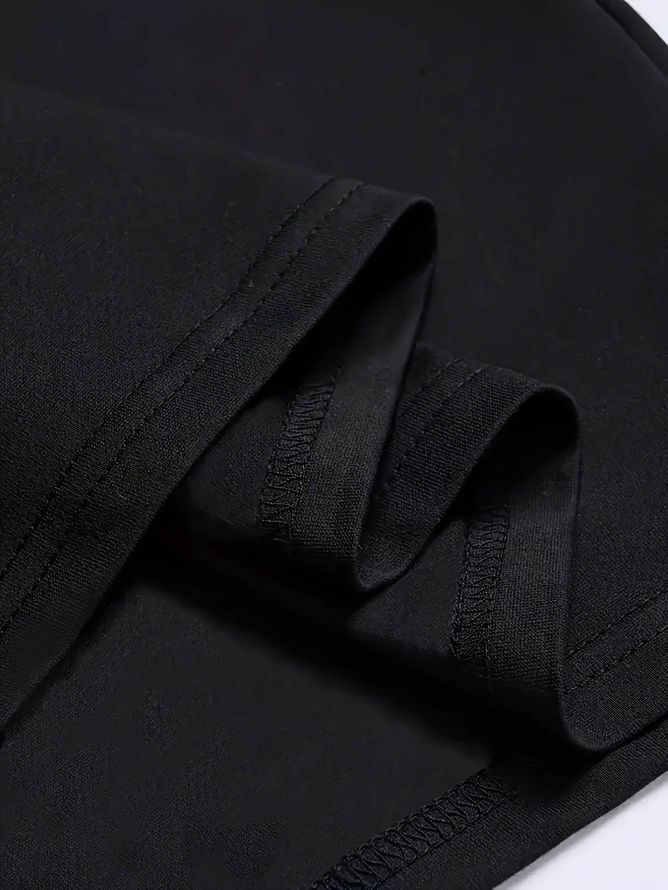 Close-up of black fabric stitching on Holy Mango Store summer faith tee for men