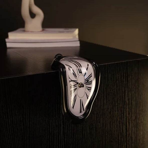 Holy Mango Store DALI inspired melting clock draped over a black shelf edge home decor