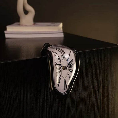 Holy Mango Store DALI inspired melting clock draped over a black shelf edge home decor