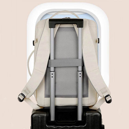 Holy Mango Store beige large capacity travel backpack on suitcase with trolley sleeve and padded back panel