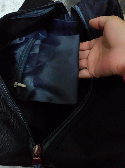 Holy Mango Store black yoga backpack with mat holder showing open main compartment and interior zip pocket